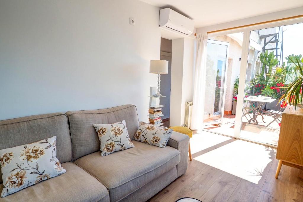 Posezení v ubytování Secret Garden Apartment by Hello Homes Sitges