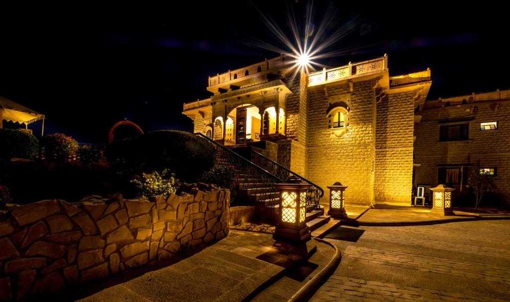 a building with a light on top of it at night at Hotel Rawalkot Jaisalmer in Jaisalmer