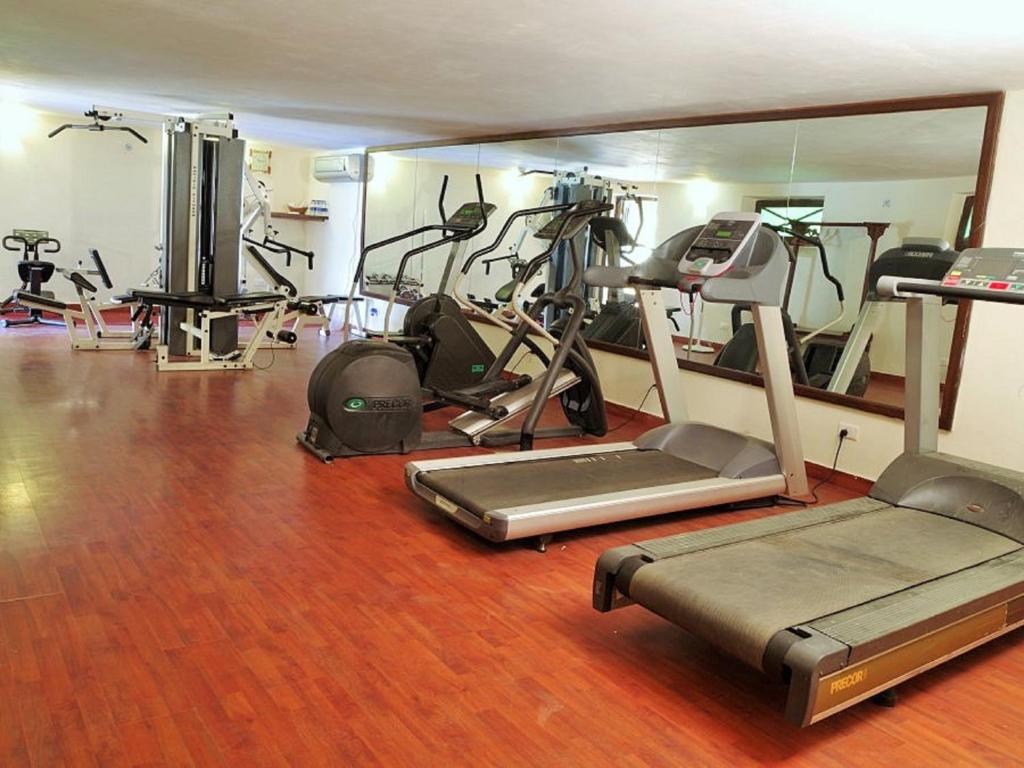 a gym with several exercise equipment in a room at Hotel Rawalkot Jaisalmer in Jaisalmer