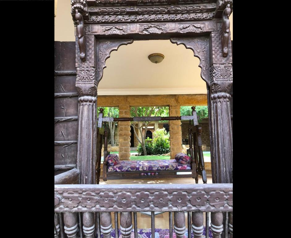 an ornate gate to a garden in a building at Hotel Rawalkot Jaisalmer in Jaisalmer