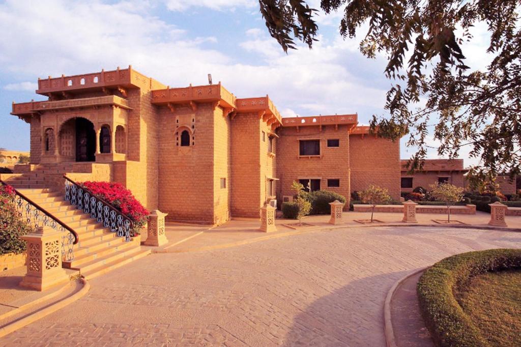 a building with a staircase in front of it at Hotel Rawalkot Jaisalmer in Jaisalmer