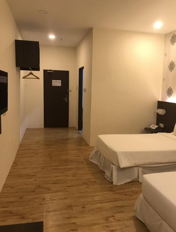 Postel nebo postele na pokoji v ubytování Casa Bonita Hotel