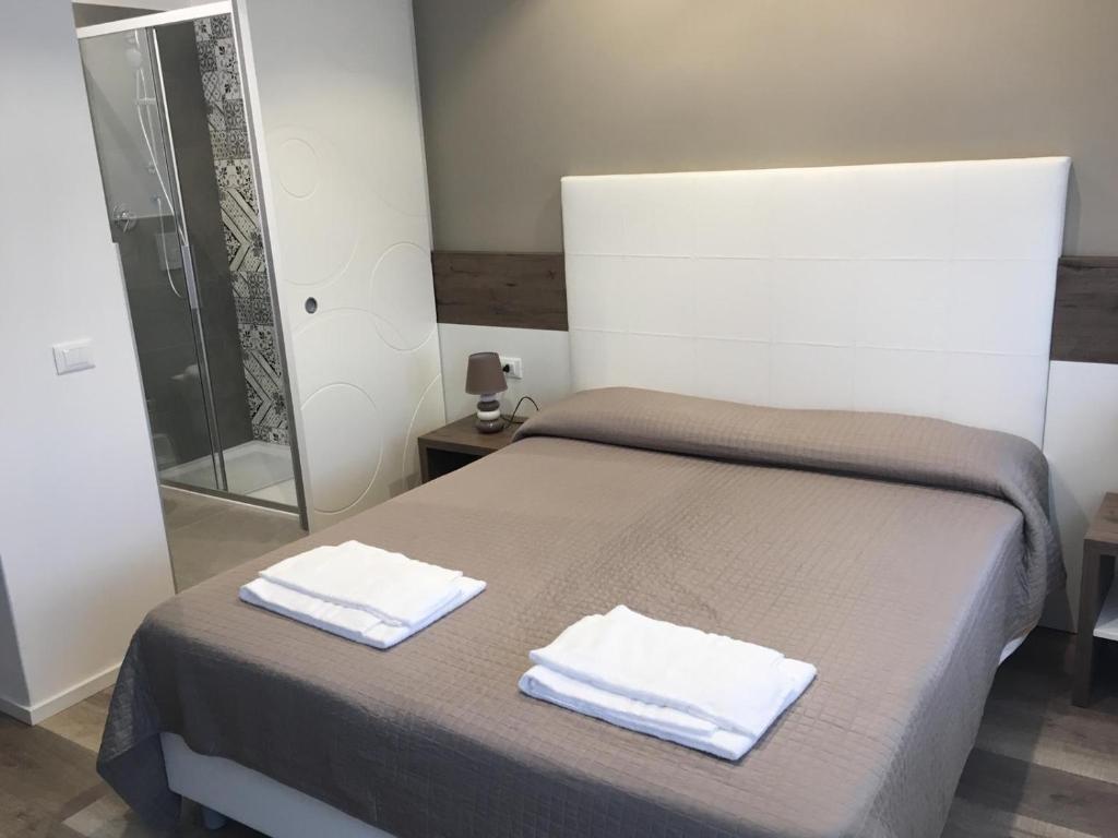 Postel nebo postele na pokoji v ubytování Albergo Rosa