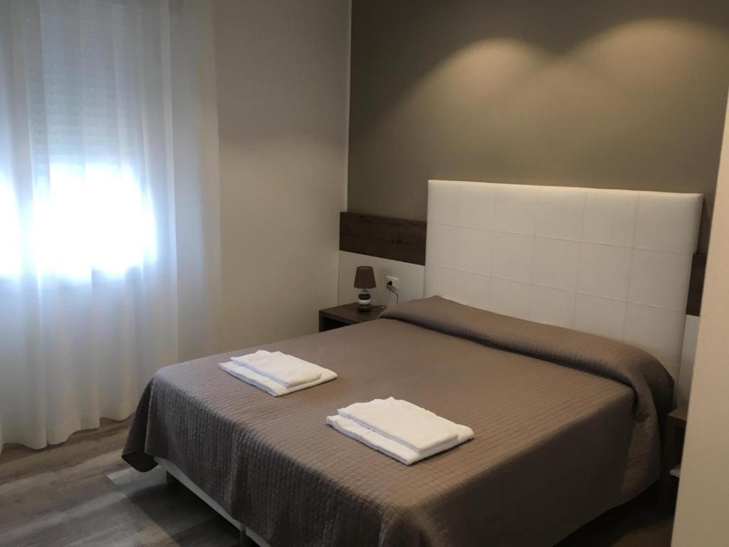 Postel nebo postele na pokoji v ubytování Albergo Rosa