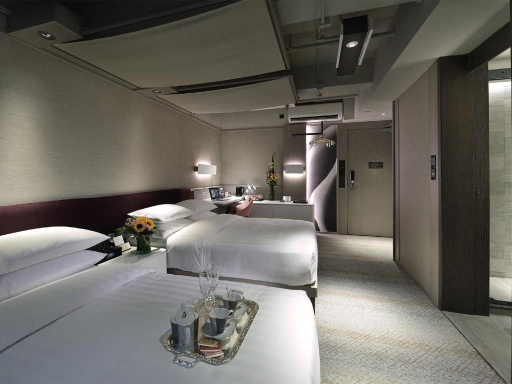 Letto o letti in una camera di Xi Hotel