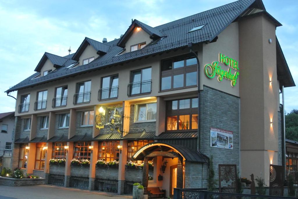 a building with a sign on the front of it at Hotel Jägerhof in Weibersbrunn