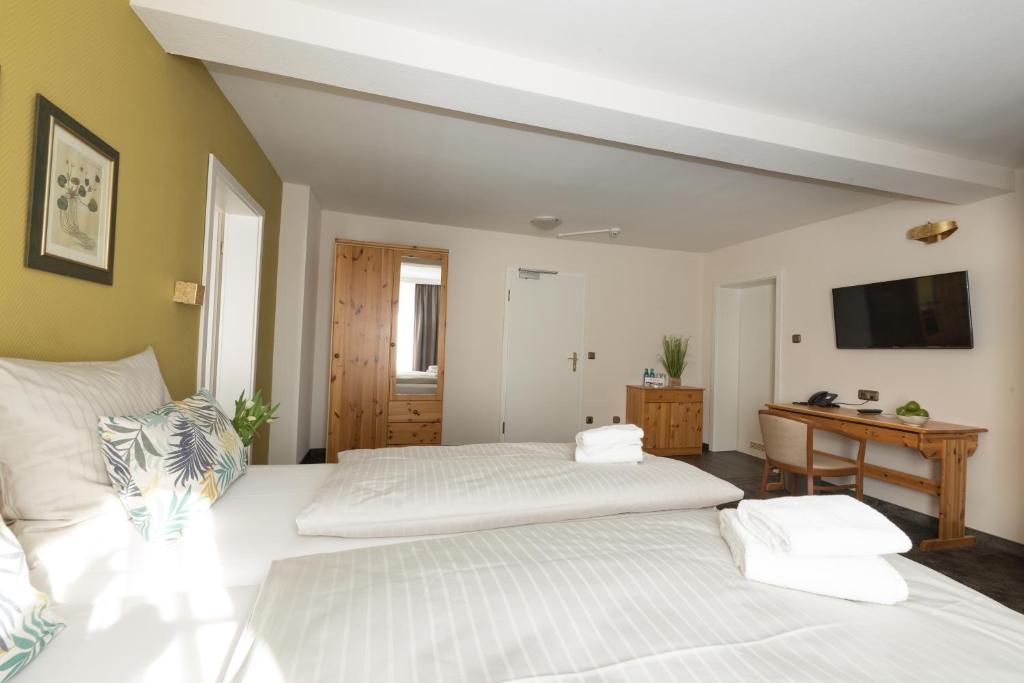 Postel nebo postele na pokoji v ubytování Hotel Residenz23
