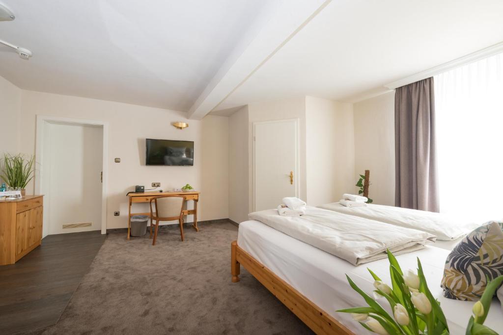 Postel nebo postele na pokoji v ubytování Hotel Residenz23