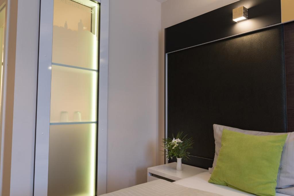Postel nebo postele na pokoji v ubytování Hotel Residenz23