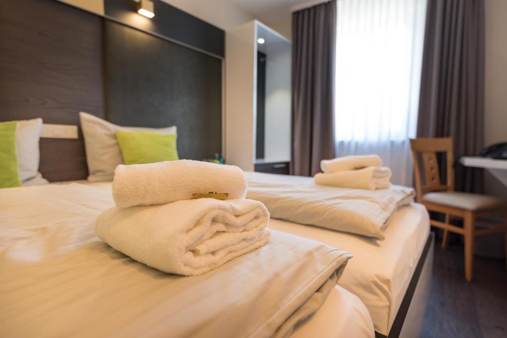 Postel nebo postele na pokoji v ubytování Hotel Residenz23