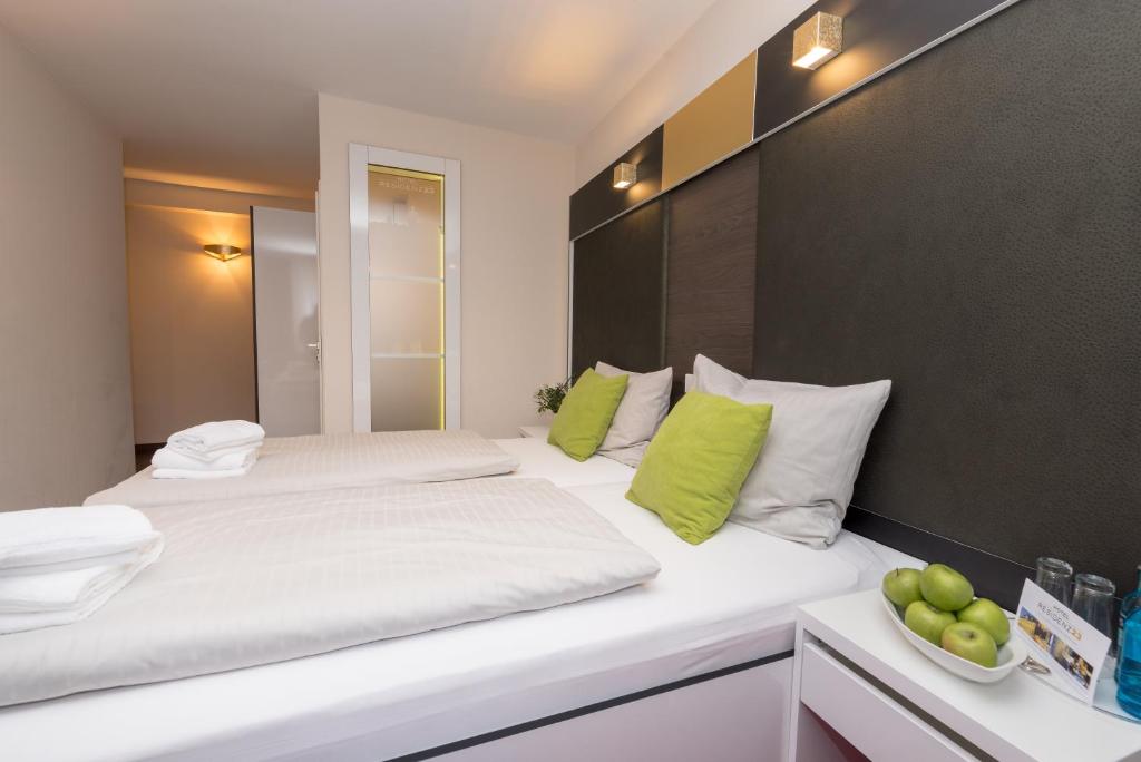 Postel nebo postele na pokoji v ubytování Hotel Residenz23