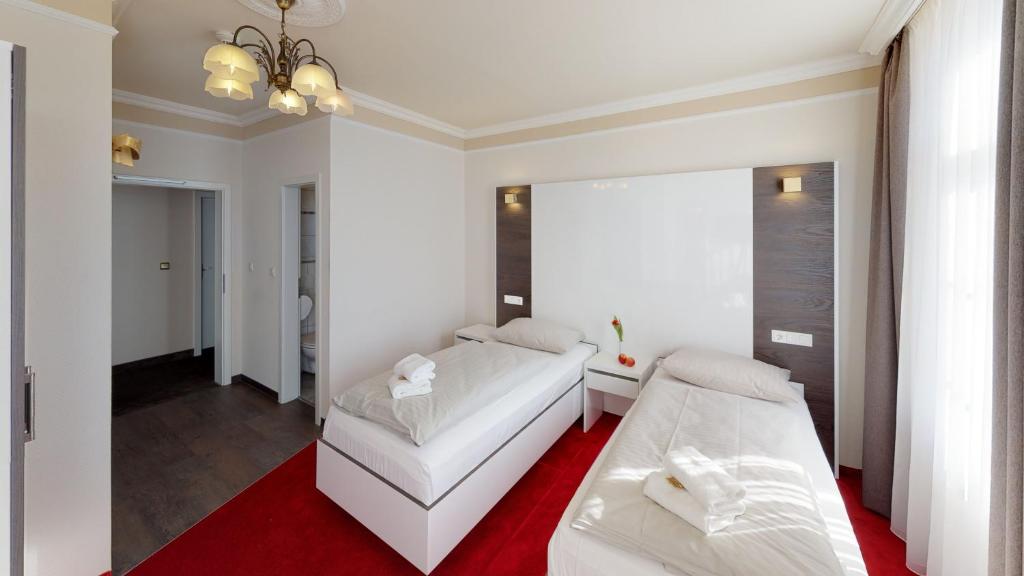 Postel nebo postele na pokoji v ubytování Hotel Residenz23