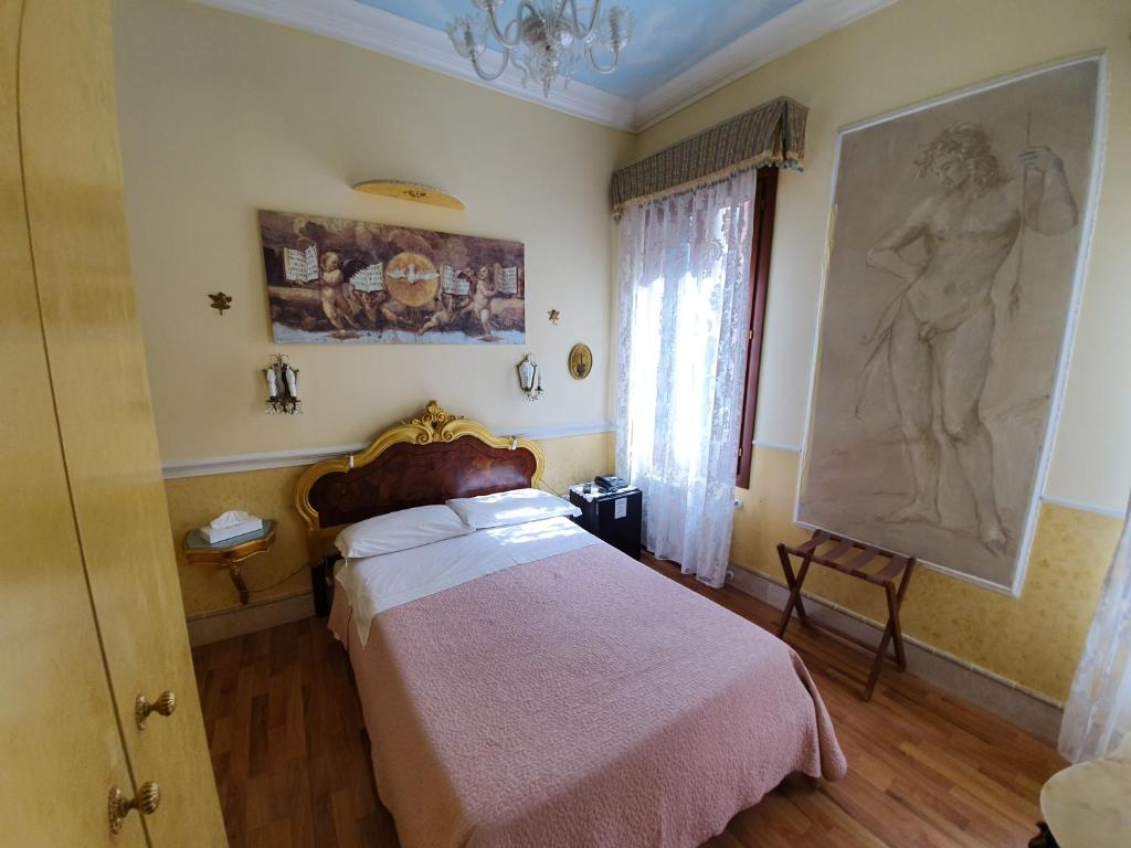 Postel nebo postele na pokoji v ubytování Casa Alla Fenice