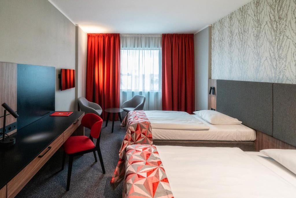Posteľ alebo postele v izbe v ubytovaní HP Park Plaza