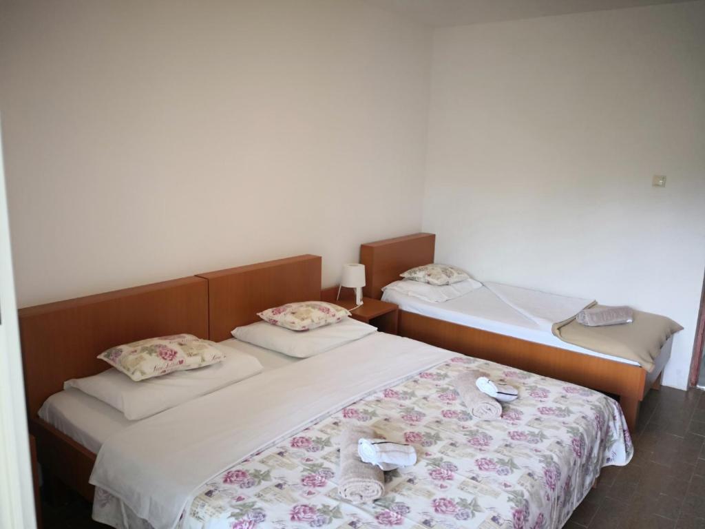 Postel nebo postele na pokoji v ubytování Guesthouse Dupin