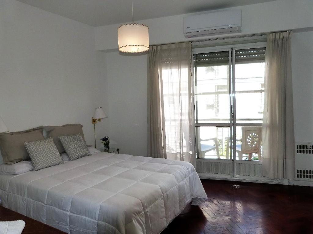 מיטה או מיטות בחדר ב-Alto Palermo, ,espacio y luz