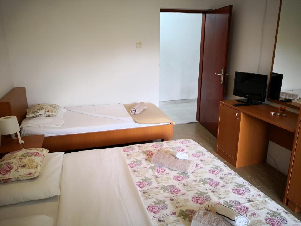 Postel nebo postele na pokoji v ubytování Guesthouse Dupin