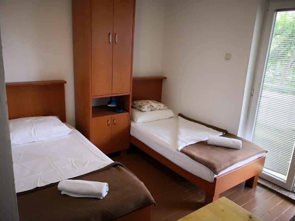 Postel nebo postele na pokoji v ubytování Guesthouse Dupin