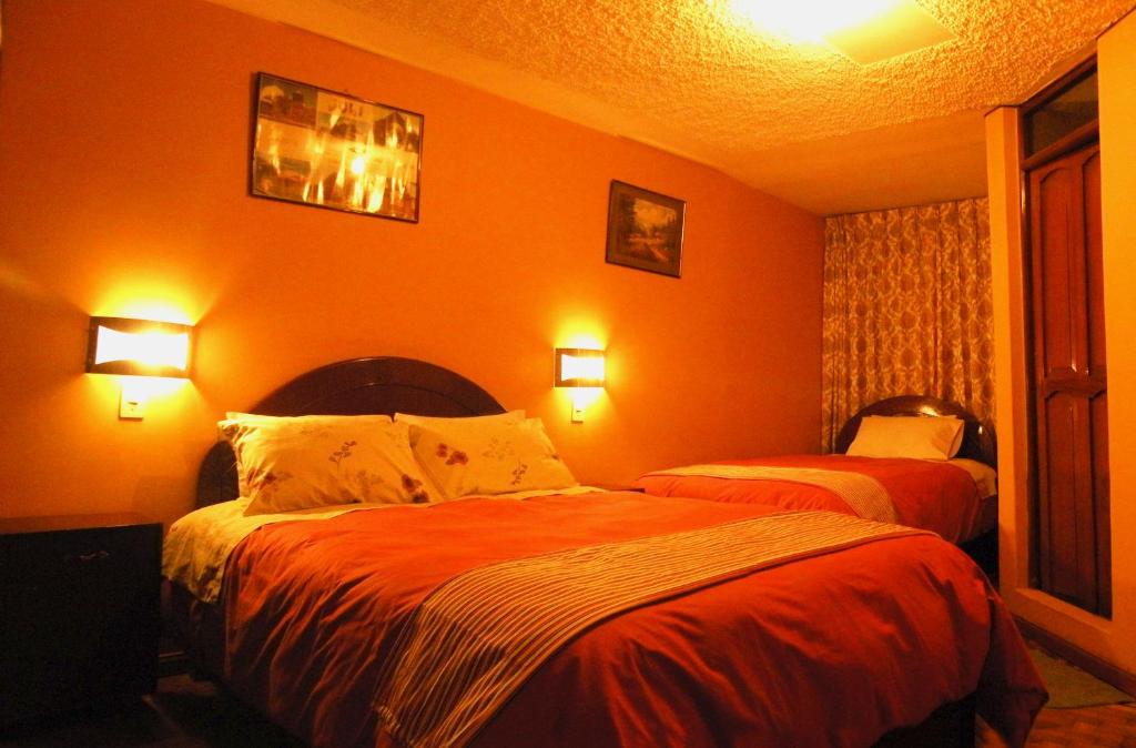 Postel nebo postele na pokoji v ubytování Hotel Margarita