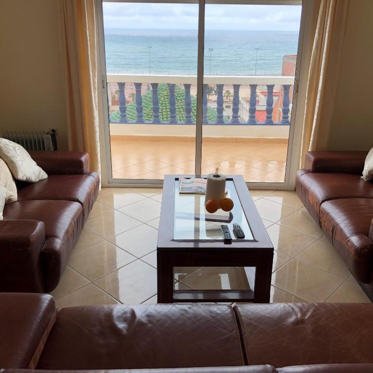 a living room with a couch and a coffee table at Oued Laou Sea View واد لاو in Oued Laou