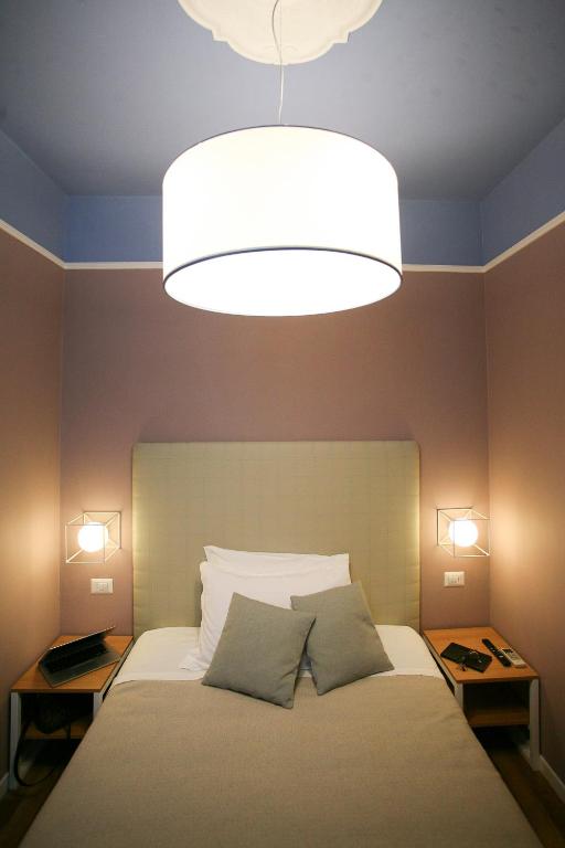 Postel nebo postele na pokoji v ubytování Hotel Il Sole