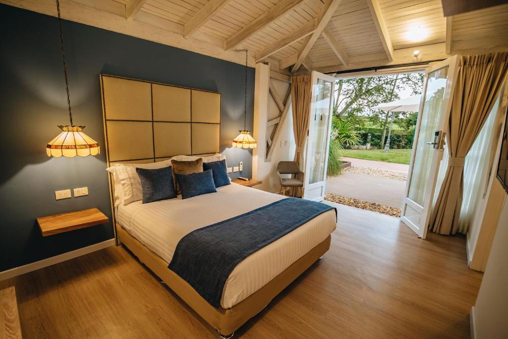 Postel nebo postele na pokoji v ubytování Hotel Boutique El Triángulo