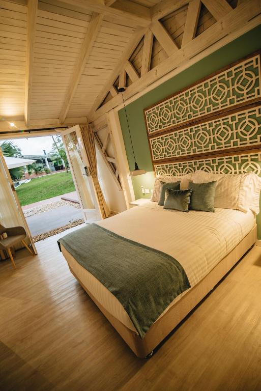 Postel nebo postele na pokoji v ubytování Hotel Boutique El Triángulo