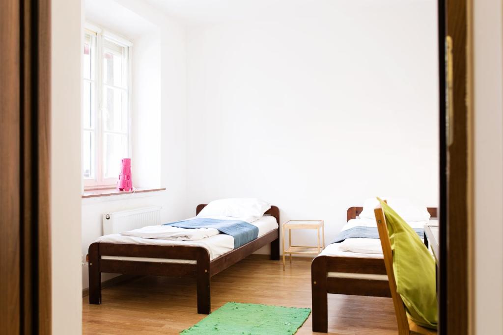 Posteľ alebo postele v izbe v ubytovaní Folk Hostel