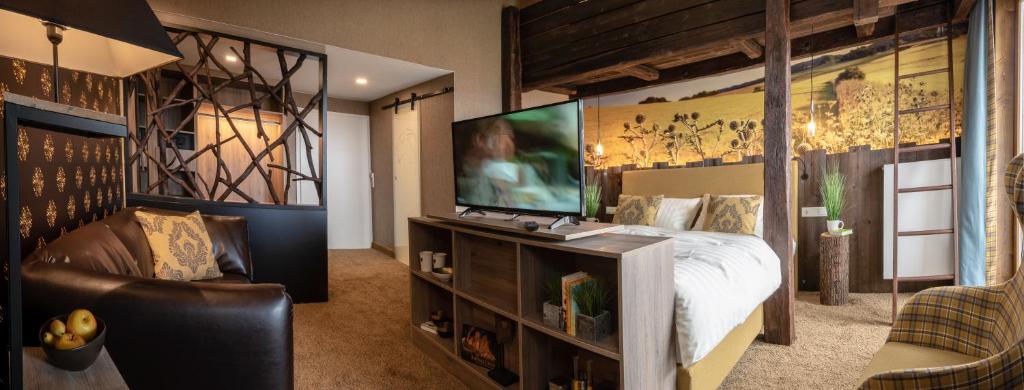 TV a/nebo společenská místnost v ubytování Berggasthof & Hotel Sennhütte