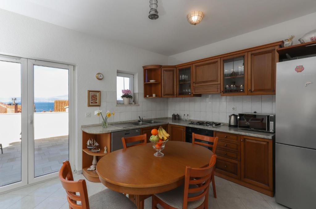 Kuchyň nebo kuchyňský kout v ubytování Apartment Perina
