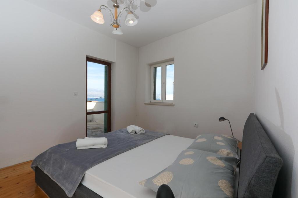 Postel nebo postele na pokoji v ubytování Apartment Perina