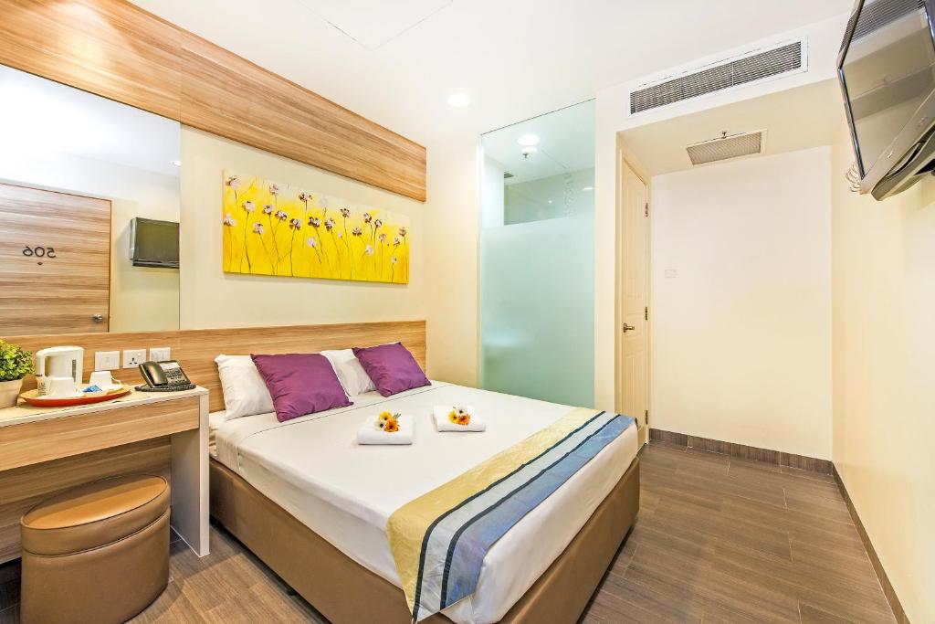 Postel nebo postele na pokoji v ubytování Hotel 81 Dickson