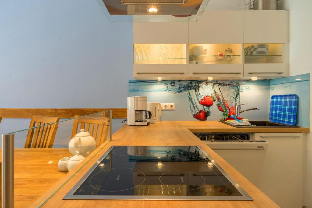 Kuchyň nebo kuchyňský kout v ubytování neyland apartments Norderney