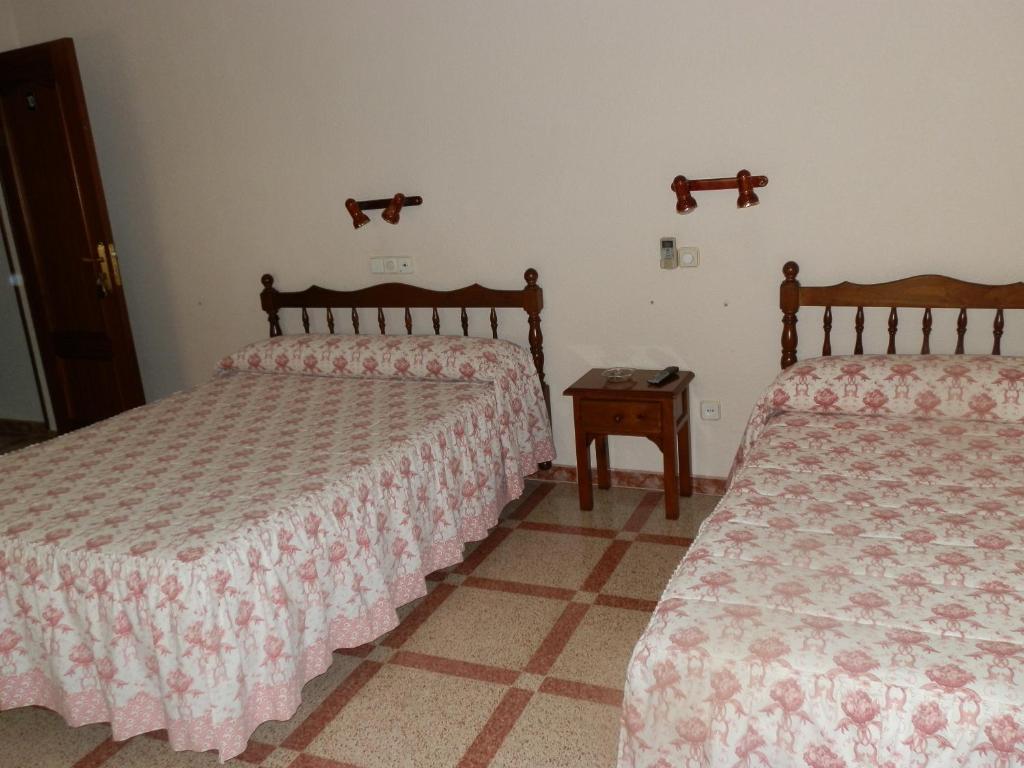Postel nebo postele na pokoji v ubytování Hostal San Poul