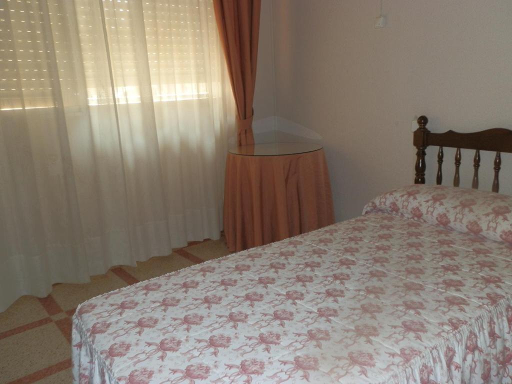 Postel nebo postele na pokoji v ubytování Hostal San Poul