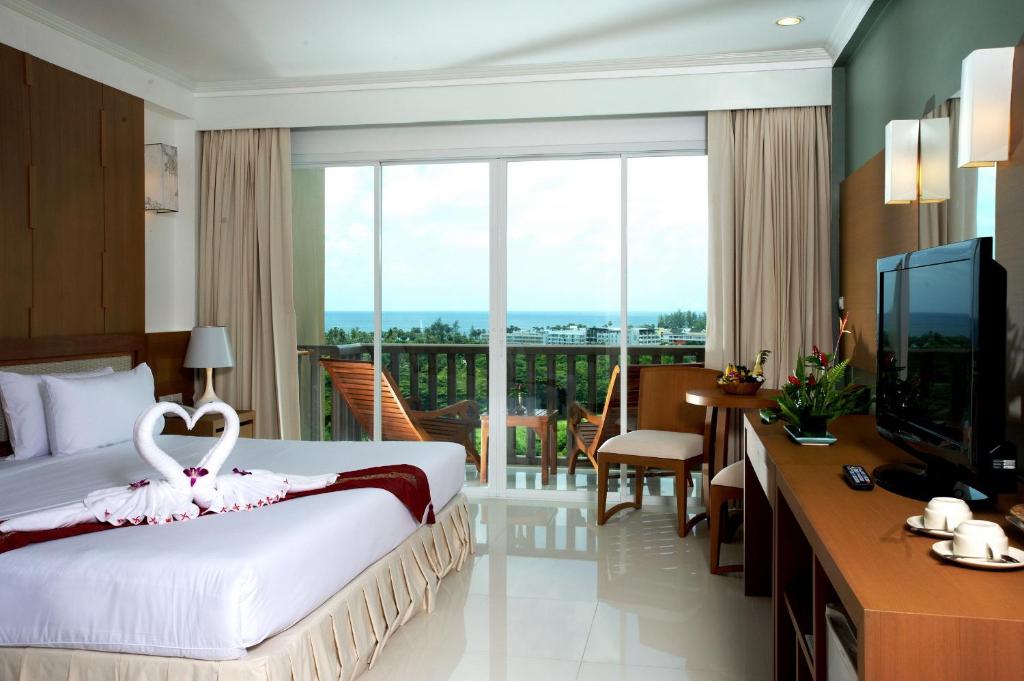 Postel nebo postele na pokoji v ubytování Princess Seaview Resort & Spa - SHA Plus