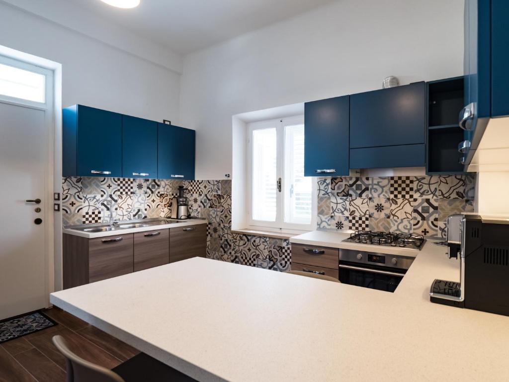 A kitchen or kitchenette at B&B VILLA TOZZA
