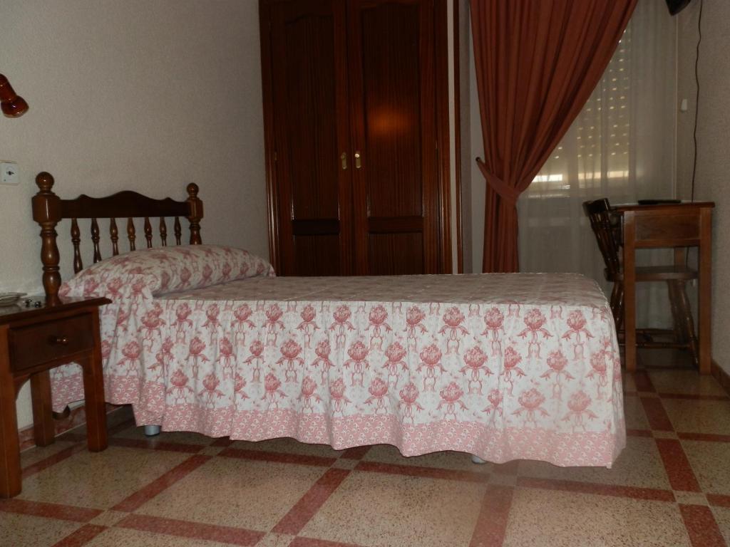 Postel nebo postele na pokoji v ubytování Hostal San Poul