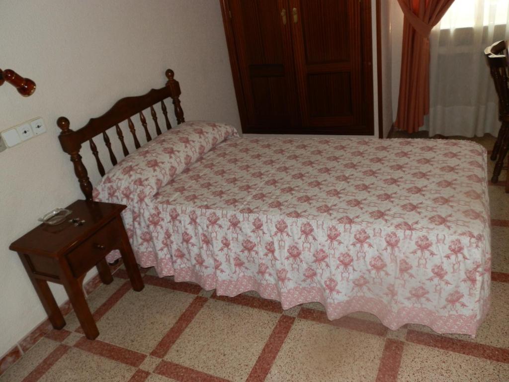 Postel nebo postele na pokoji v ubytování Hostal San Poul