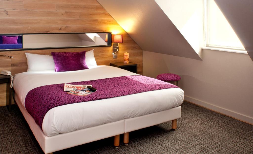 Postel nebo postele na pokoji v ubytování Hôtel Maison Turenne