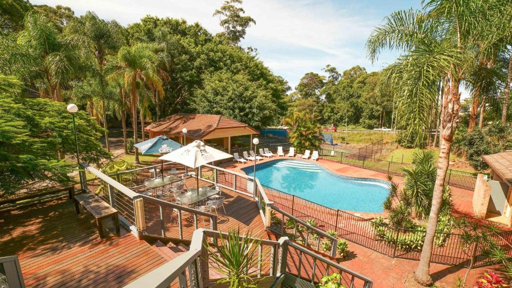 an overhead view of a swimming pool in a yard at Country 2 Coast Motor Inn Coffs Harbour in Coffs Harbour