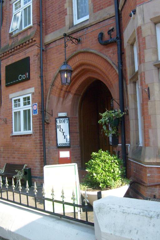 a building with a clock on the front of it at Croft Hotel in Leicester