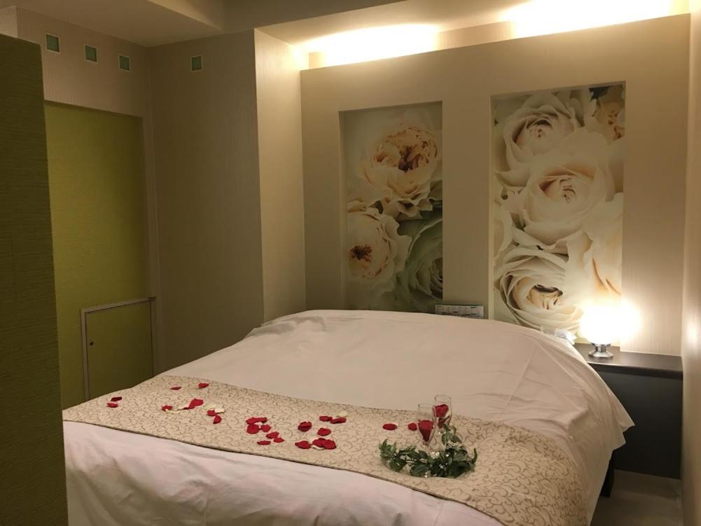 Postel nebo postele na pokoji v ubytování Hotel Water Gate Ichinomiya (Adult Only)