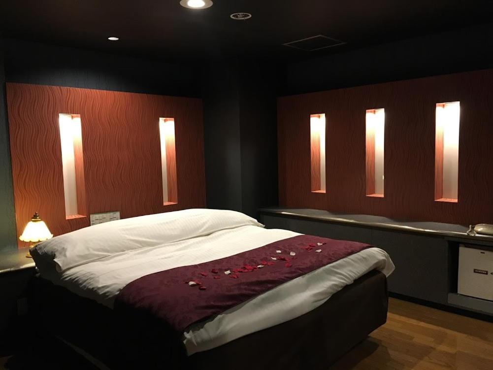 Postel nebo postele na pokoji v ubytování Hotel Water Gate Ichinomiya (Adult Only)