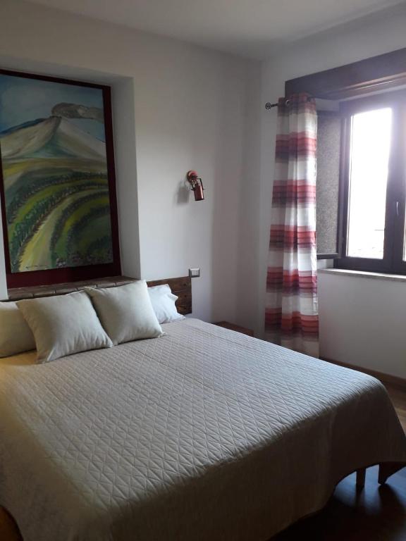Posteľ alebo postele v izbe v ubytovaní B&B Le Vie del Borgo