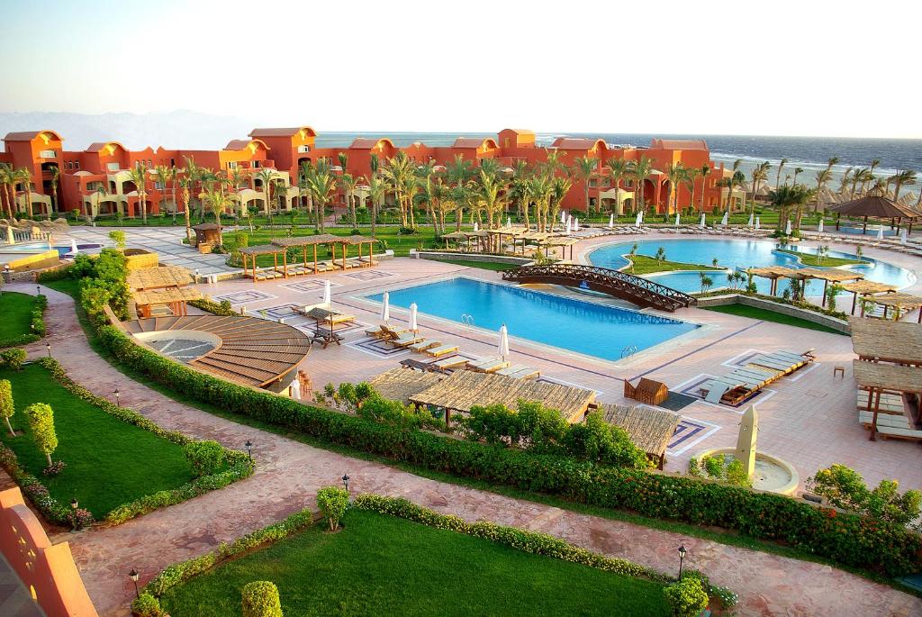 an aerial view of a resort with two pools at Sharm Grand Plaza Resort - Families and Couples Only in Sharm El Sheikh