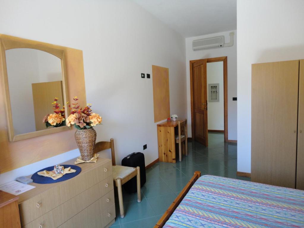 Postel nebo postele na pokoji v ubytování Hotel Silvestrino