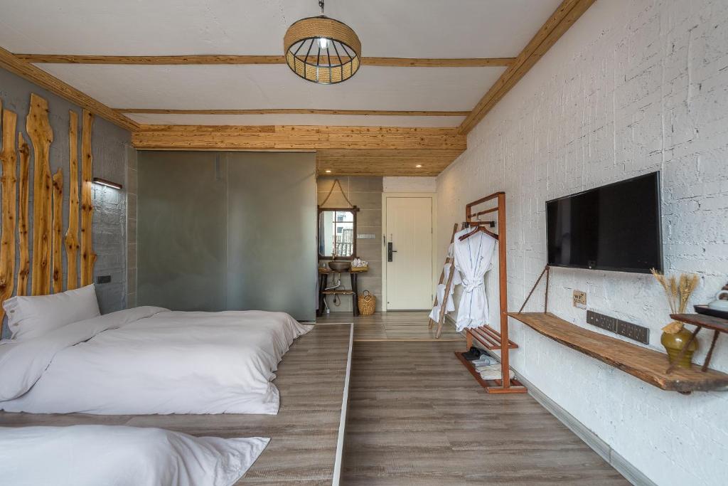 Postel nebo postele na pokoji v ubytování Autumn Inn