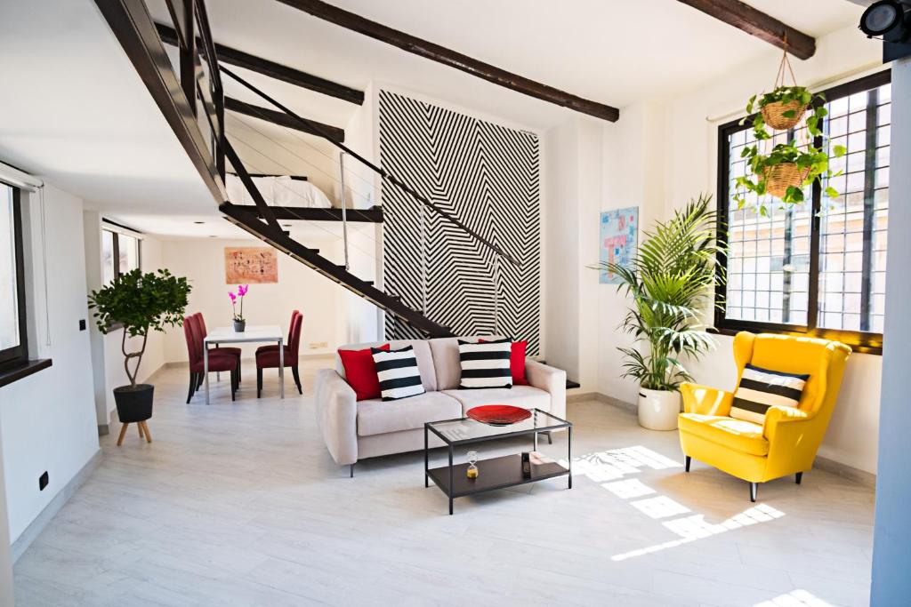 a living room with a couch and chairs and a table at Erida Apartment - Piazza di Spagna in Rome