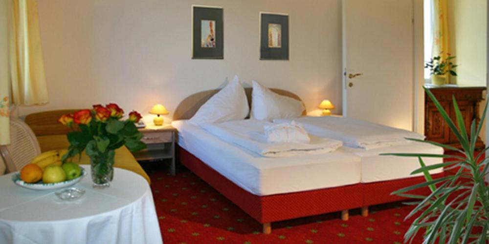 Postel nebo postele na pokoji v ubytování Villa Auguste